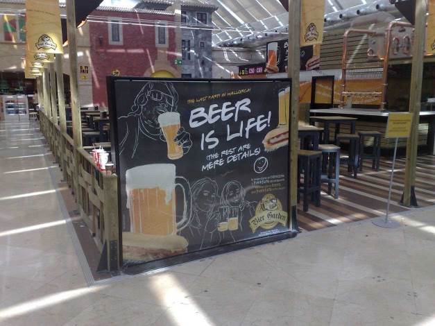 A sign saying Beer is Live