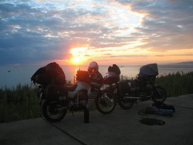 Two motorbikes in the sunset