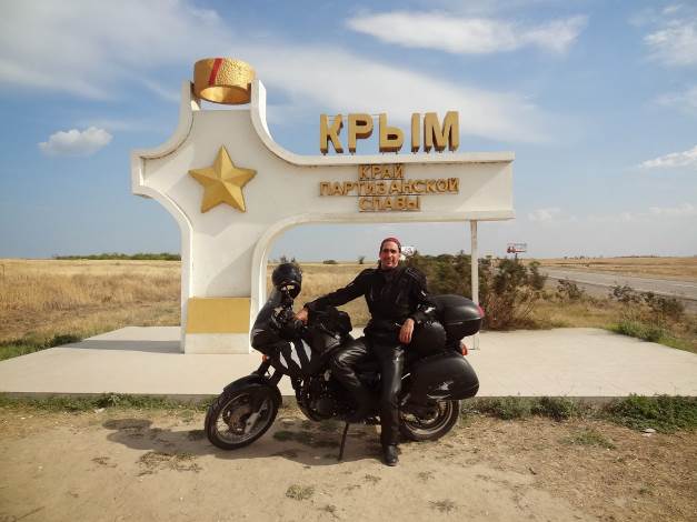 me with my Trumph Tiger infront of a sign 'Krim'
